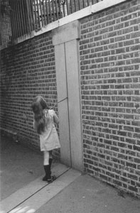 Photo of a girl with a stick on the Greenwich Meridian line